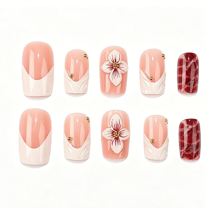 Kunstnagelset mit luxuriösen 3D-Blütenakzenten und Glitzer-Details Karnz