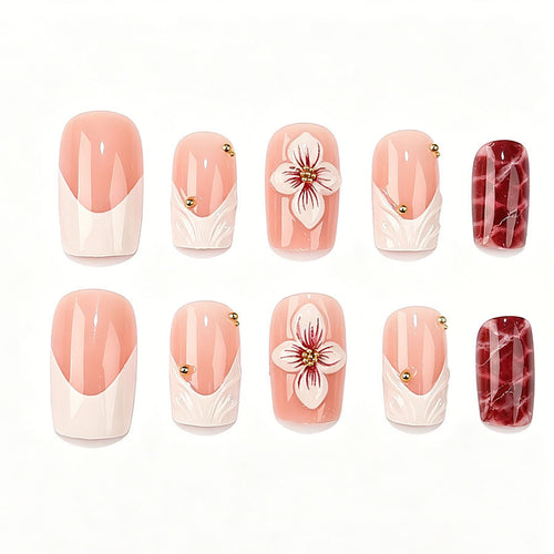 Kunstnagelset mit luxuriösen 3D-Blütenakzenten und Glitzer-Details Karnz