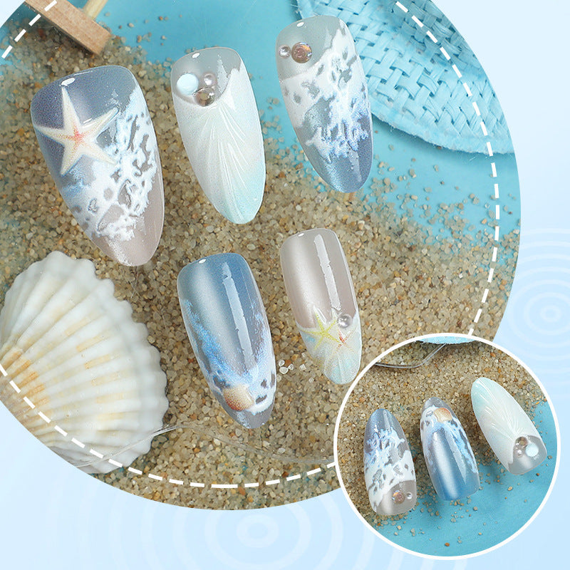 Kunstnägel mit maritimem Muschelmuster Karnz