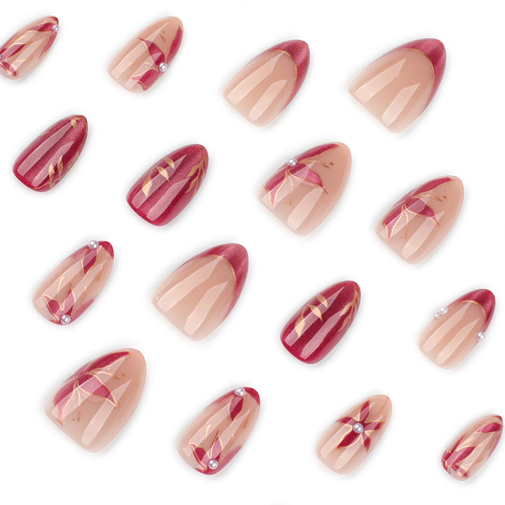 Kunstvolle Nagelverlängerungen mit retro-inspiriertem floralem Design Karnz