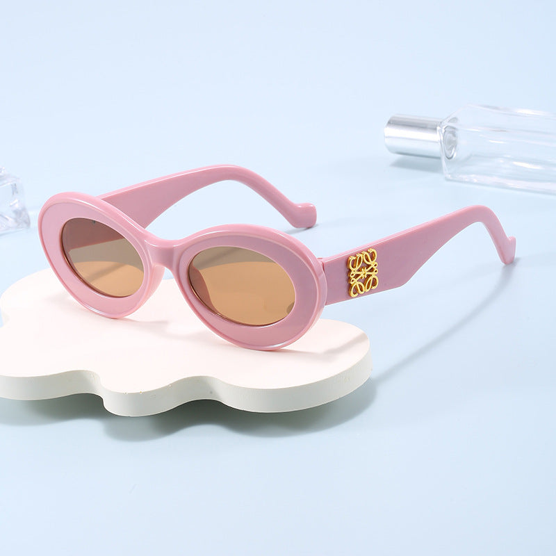 Damen modische Sonnenbrille mit ovalem Rahmen und goldenen Applikationen Karnz