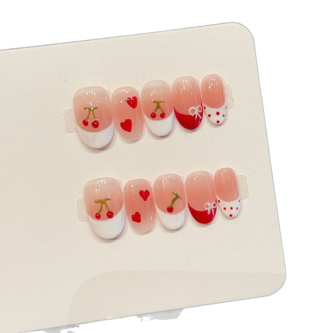 Dekoratives Press-On Nagelkunst-Set mit Kirsch- und Herzdesigns