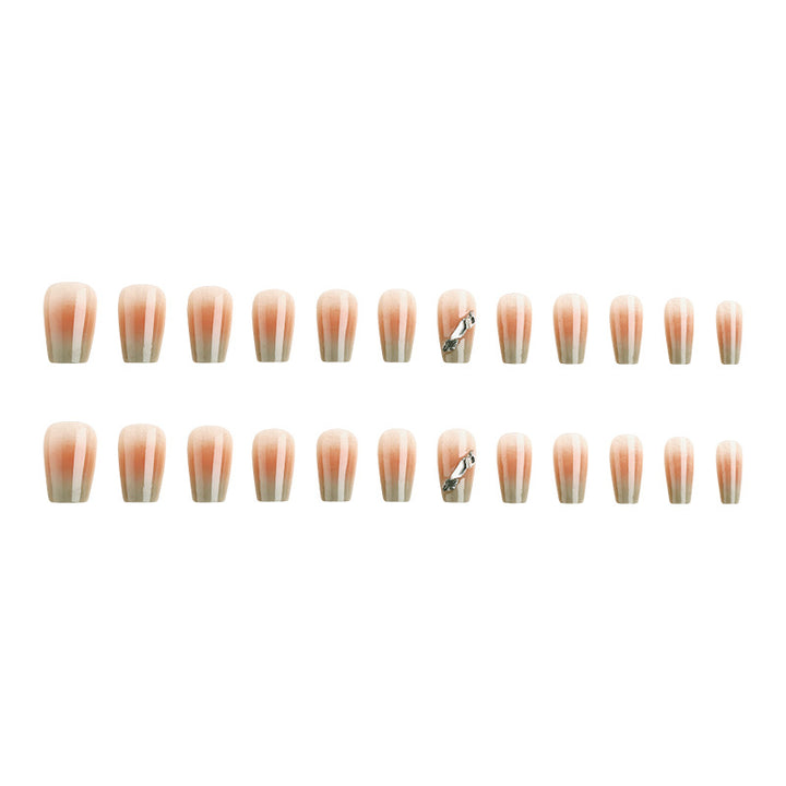 Kunstnagelset mit elegantem Ombre-Design und funkelnden Applikationen Karnz