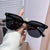 Damen modische Sonnenbrille im minimalistischem Design Karnz