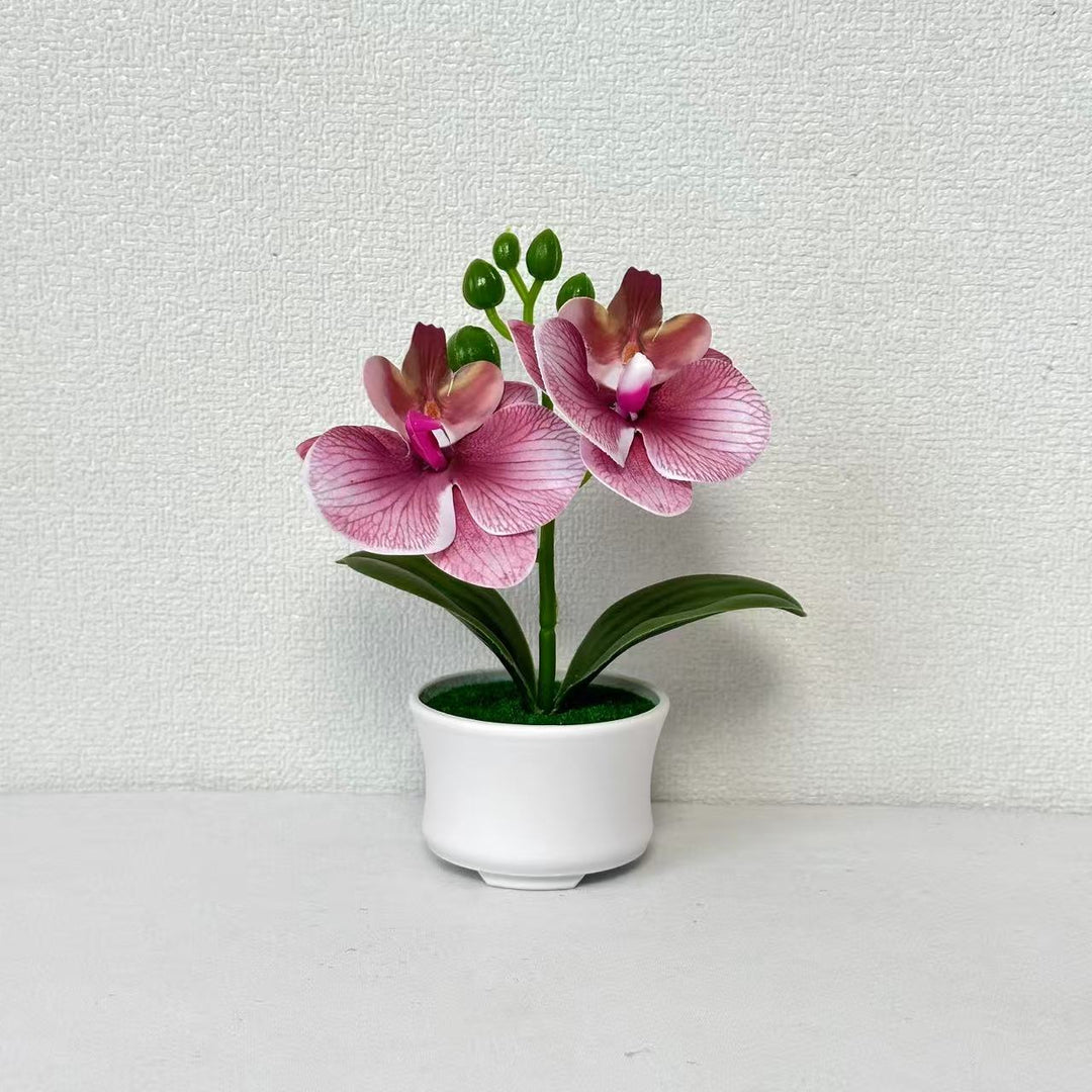 Elegante künstliche Orchideenpflanzenanordnung für die Innendekoration