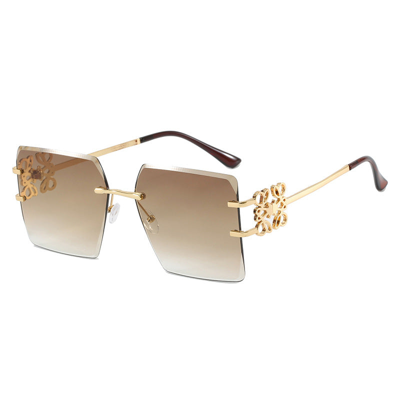 Damen modische Sonnenbrille mit außergewöhnlichem Design und goldenen Akzenten Karnz