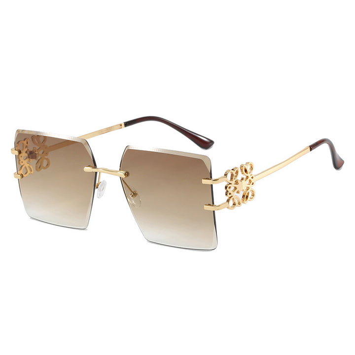 Damen modische Sonnenbrille mit außergewöhnlichem Design und goldenen Akzenten Karnz