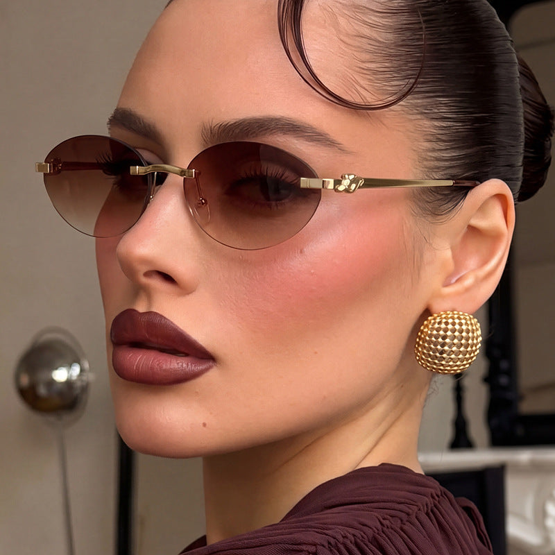 Damen elegante ovale Sonnenbrille mit goldenen Akzenten Karnz