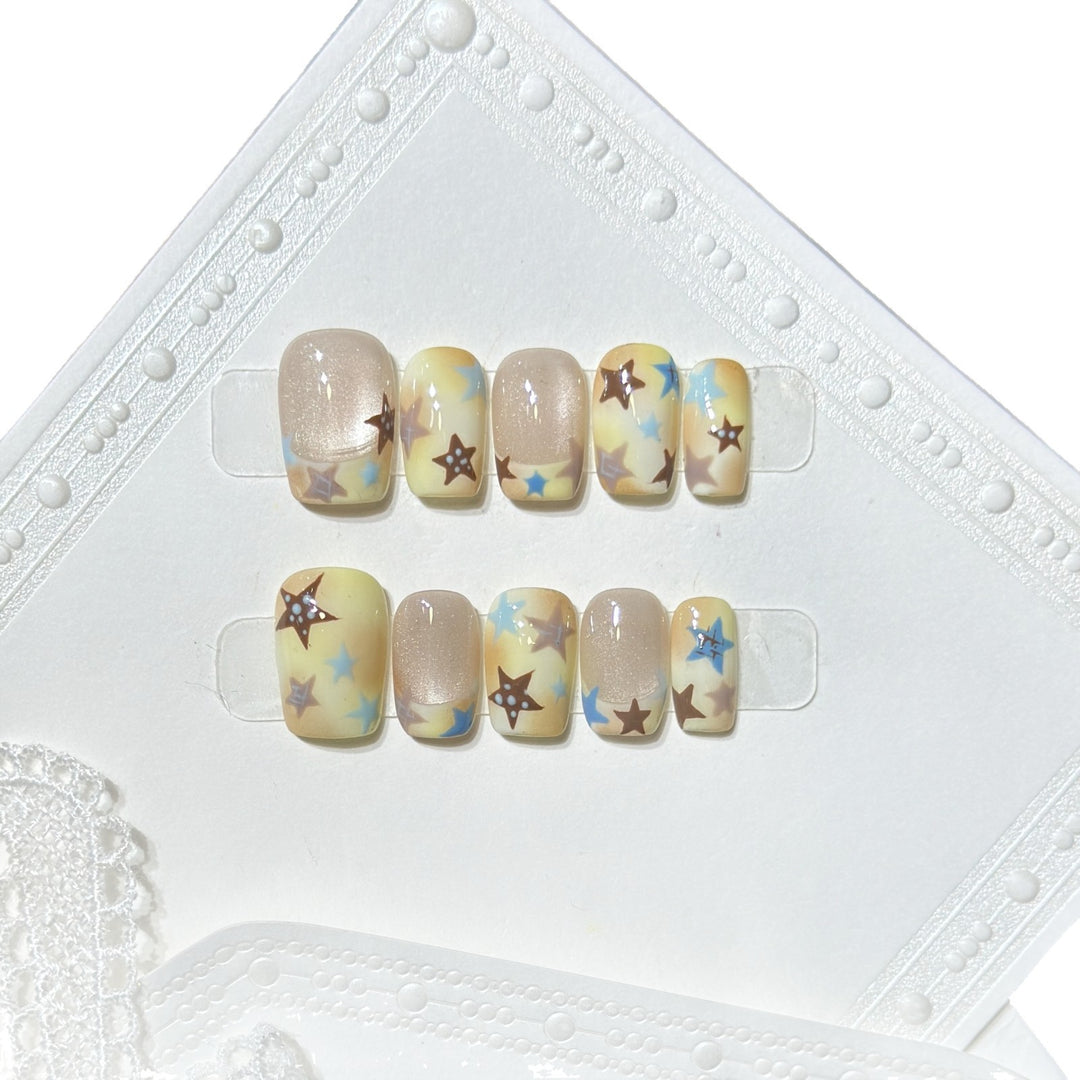 Press-On Nagelkunst Set mit Sterne Akzenten Karnz