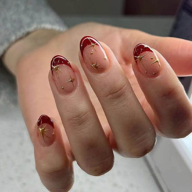 Kunstnagelset mit glamourösen Sternenmotiven und elegantem Farbverlauf Karnz