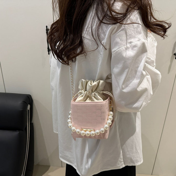 Elegante Mini-Eimer-Tasche mit Perlenhenkel Karnz