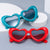 Damen Herzförmige Sonnenbrille mit stylischem Rahmen Karnz