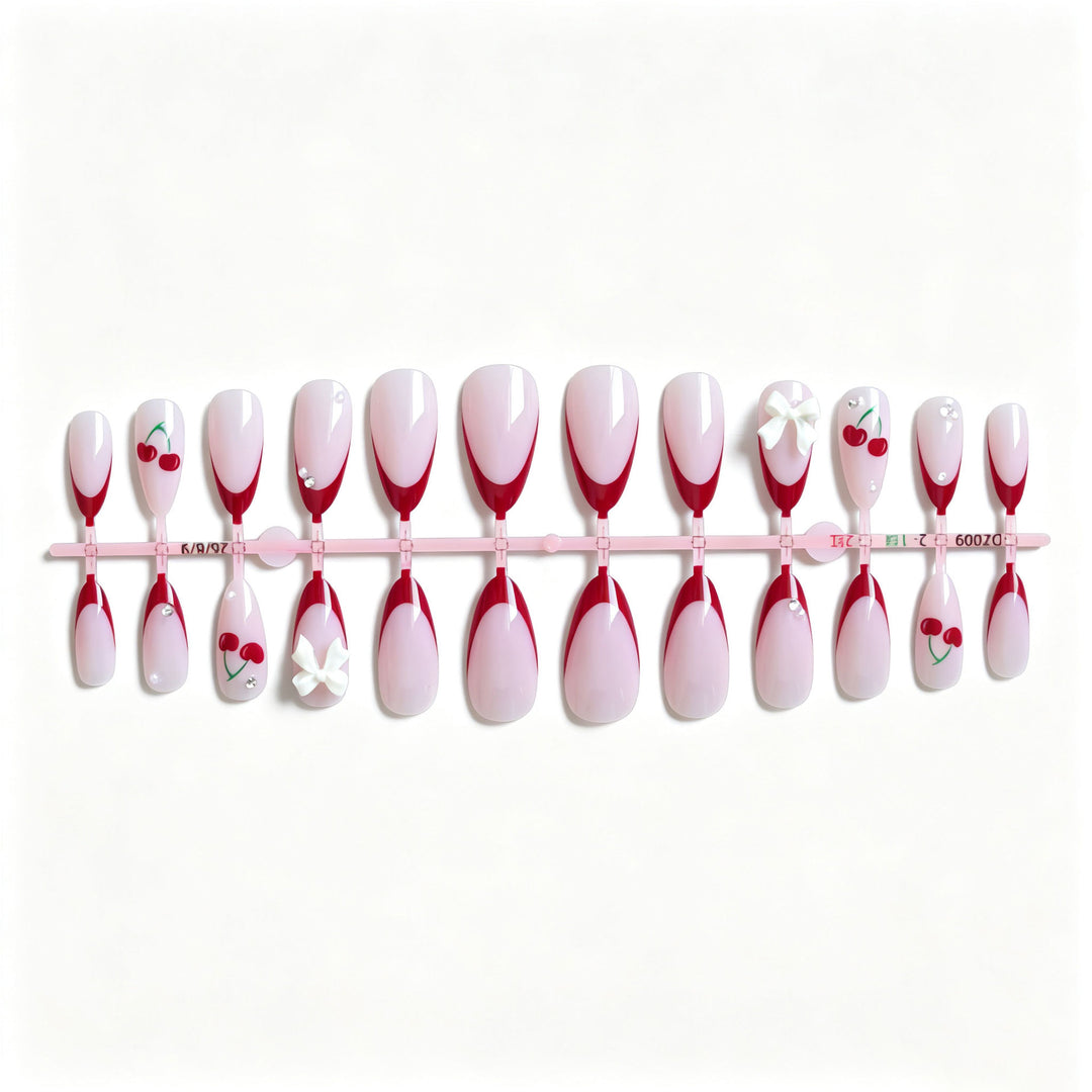 Künstlerisches Kirsch- und Schleifen-Nageldesign