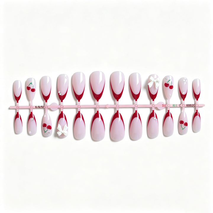 Künstlerisches Kirsch- und Schleifen-Nageldesign