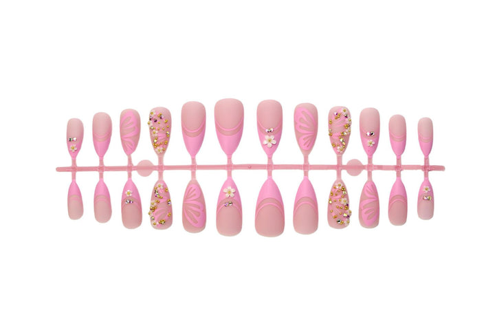 Kunstnagelset mit eleganten Blüten- und Glitzerverzierungen Karnz