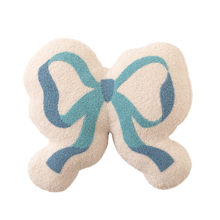 Schleifen-Dekokissen aus Bouclé mit flauschiger Teddy-Optik