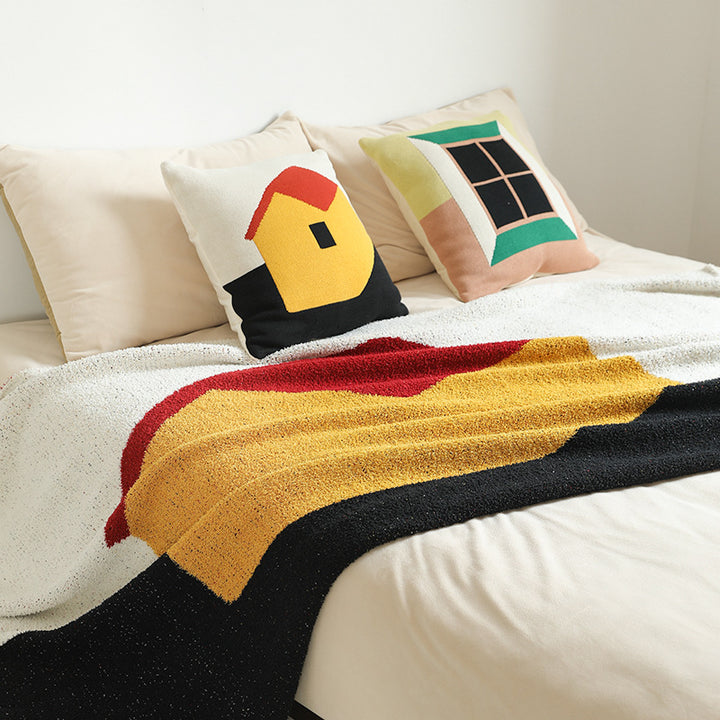 Grobgewebte Wohndecke mit geometrischem Jacquardmuster und weichem Bouclé Karnz