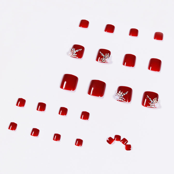 Kunstvolle Fußnagelgestaltung mit elegantem Strass-Design Karnz