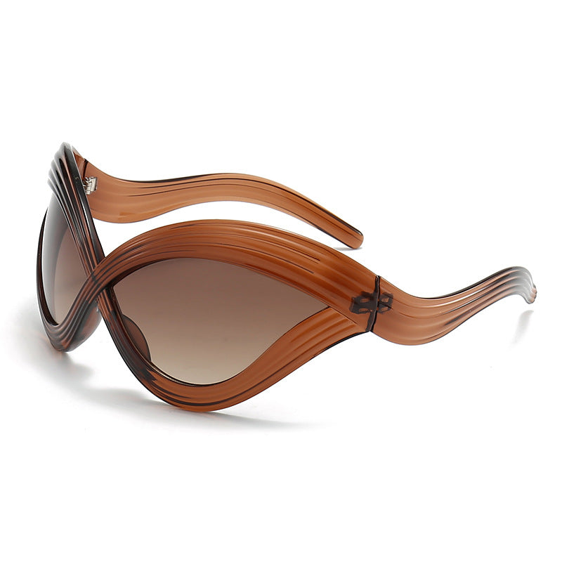 Damen außergewöhnliche Sonnenbrille mit geschwungenem Design Karnz