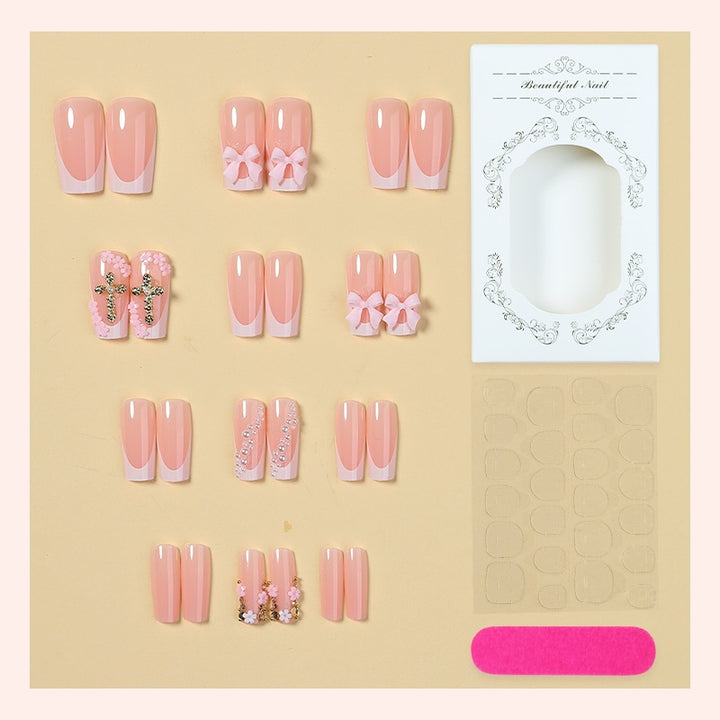 Kunstnagelset mit eleganten Schleifen- und Glitzerelementen Karnz