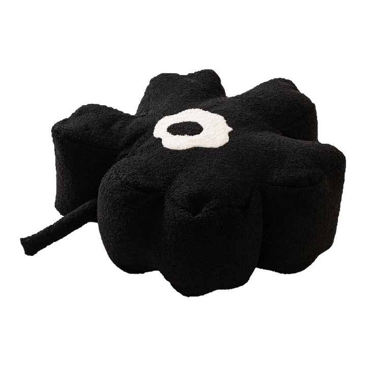 Blumenförmiger Bodensitzpouf mit Bouclé‑Bezug und segmentierter Polsterung