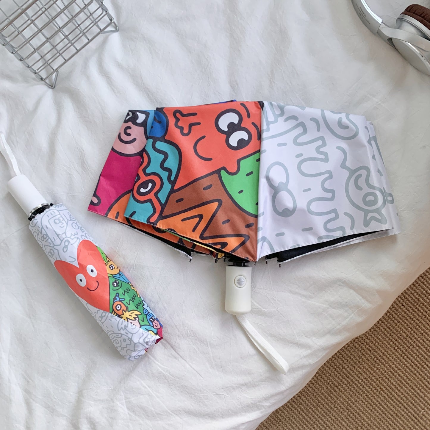 Damen Faltregenschirm mit bunten Comic-Motiven Karnz