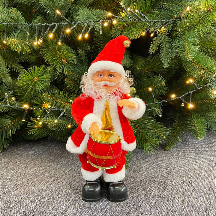 Niedlicher Weihnachtsmann mit Weihnachtsgruß-Schild Karnz