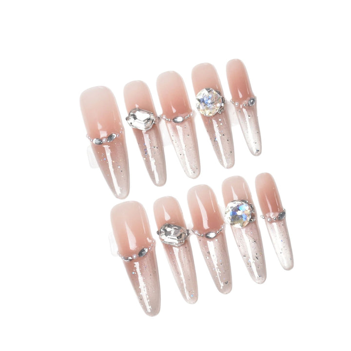 Künstlerische Stiletto Press-On Nagelkunst mit schimmernden Akzenten Karnz