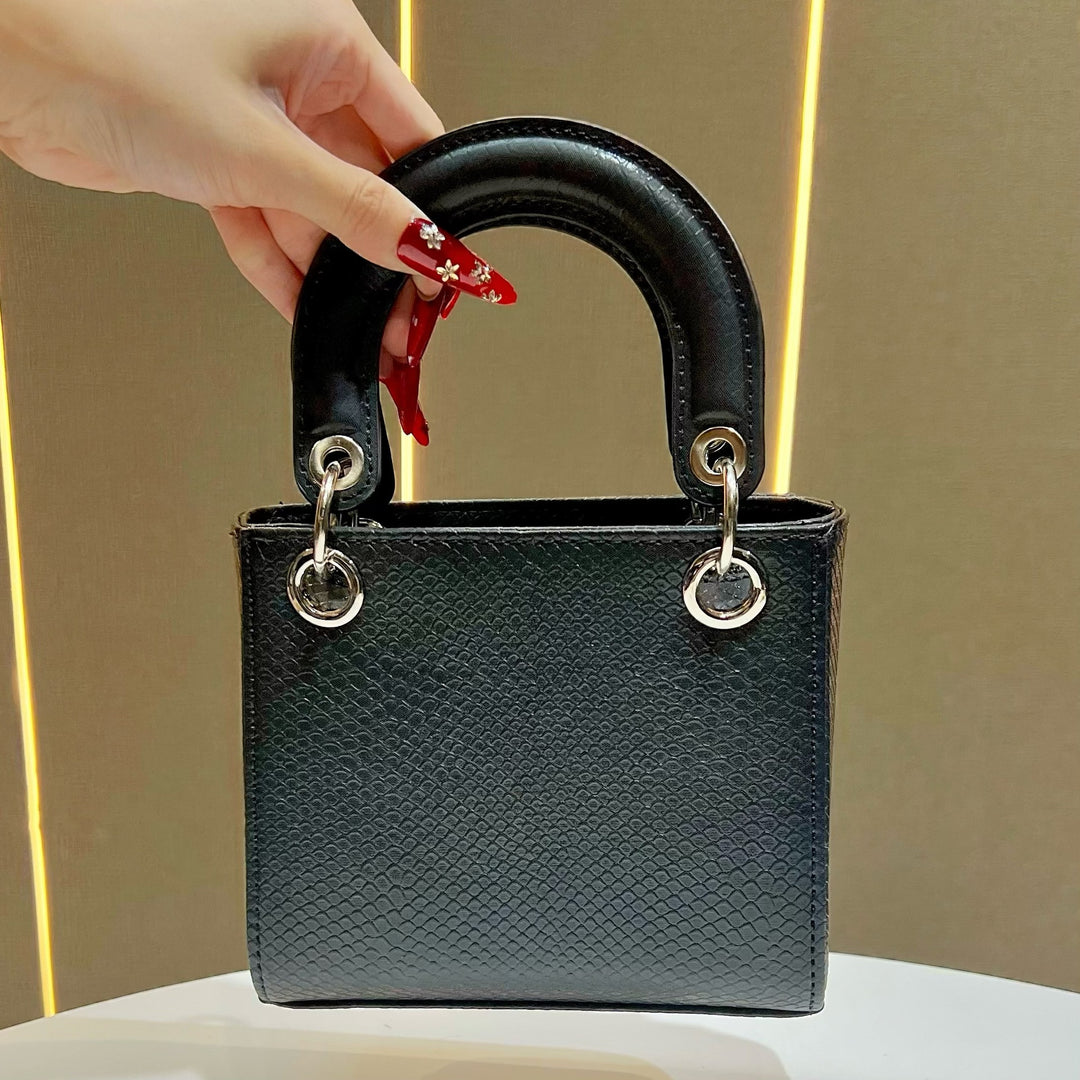 Stylische Schlangenleder-texturierte Handtasche