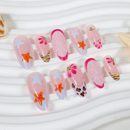Kunstnagelset mit kreativen floralen und maritimen Designs Karnz