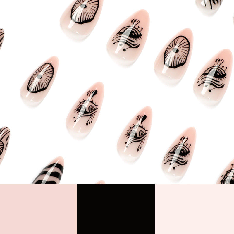 Kunstvolle Acryl-Nägel im eleganten Stiletto-Design mit grafischen Mustern Karnz