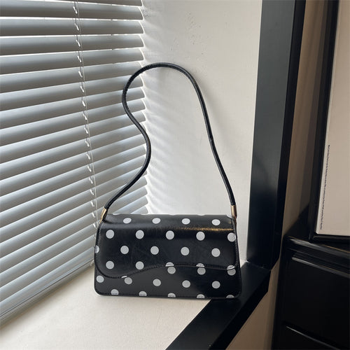 Schicke gepunktete Schultertasche