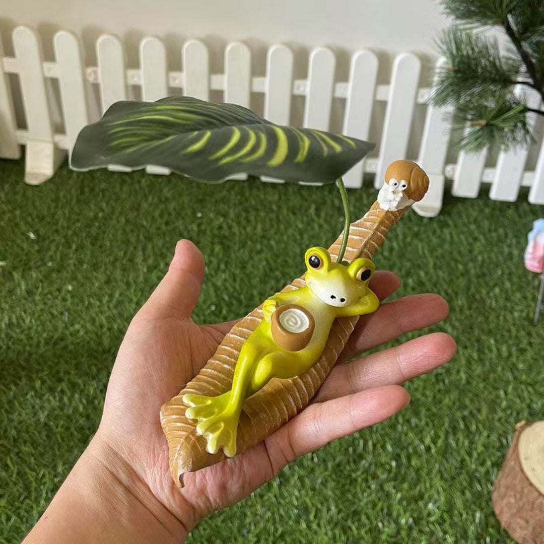 Lustige Froschfigur mit Blatt Deko Karnz