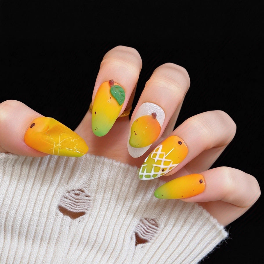 Kunstnägel mit fruchtigem Mango-Design Karnz