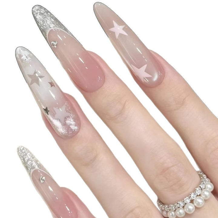Stiletto-Nagelverlängerungen mit Glitzer und Sternakzenten