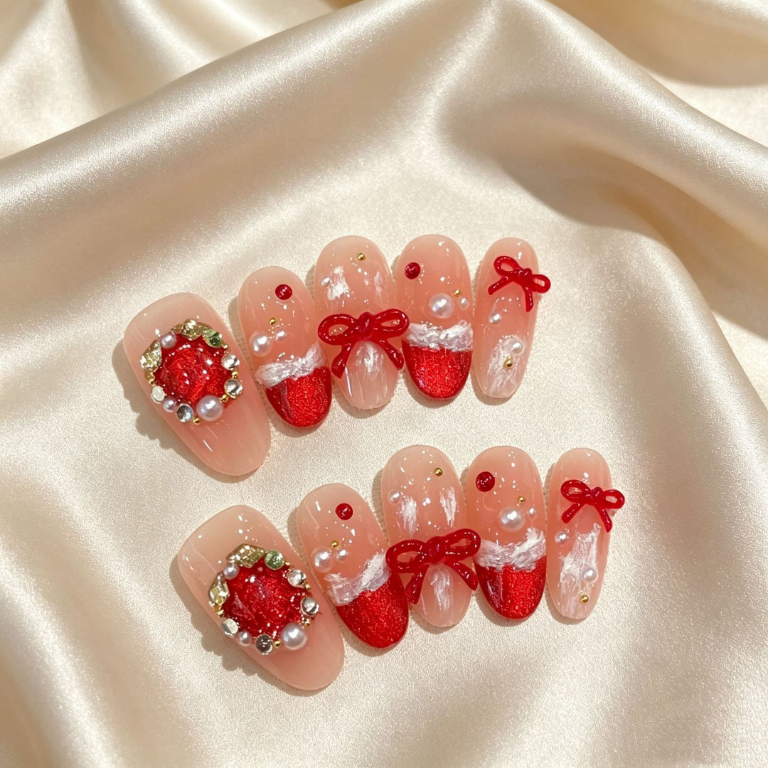 Festliches Press-On Nagelkunstset mit Schleife und Glitzerakzenten