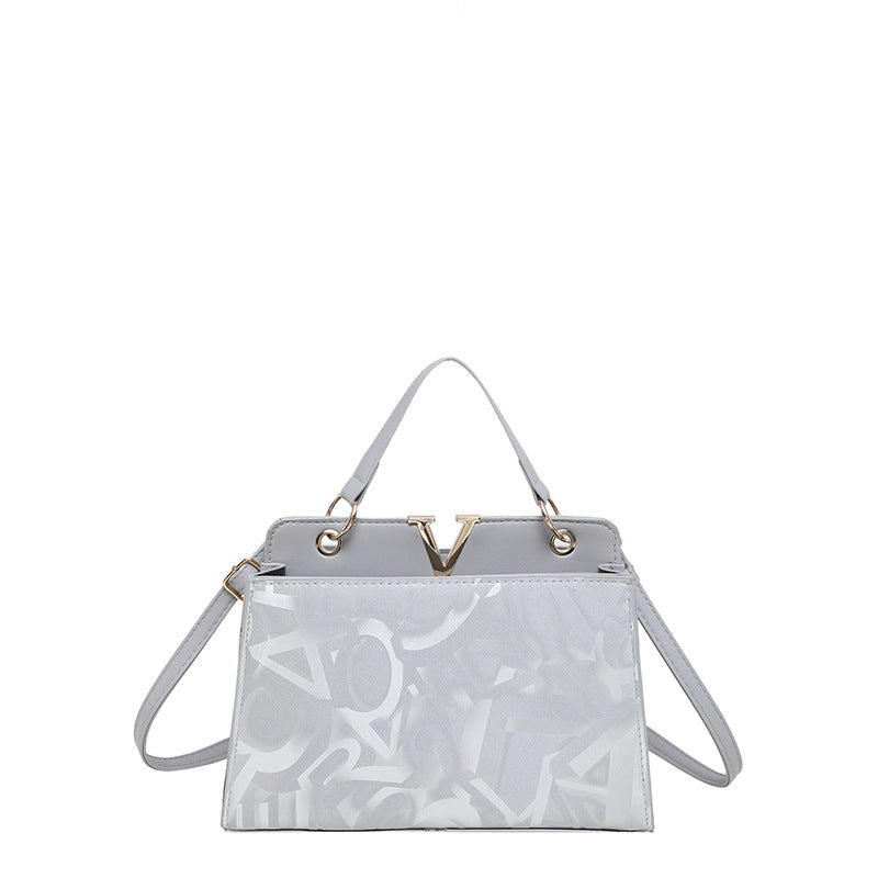 Glänzende strukturierte Handtasche