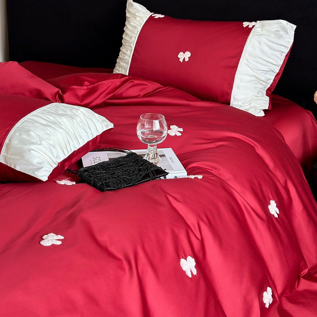 Luxuriöses Baumwollsatin-Bettwäsche-Set mit gestickten Schleifen und Rüschendetails