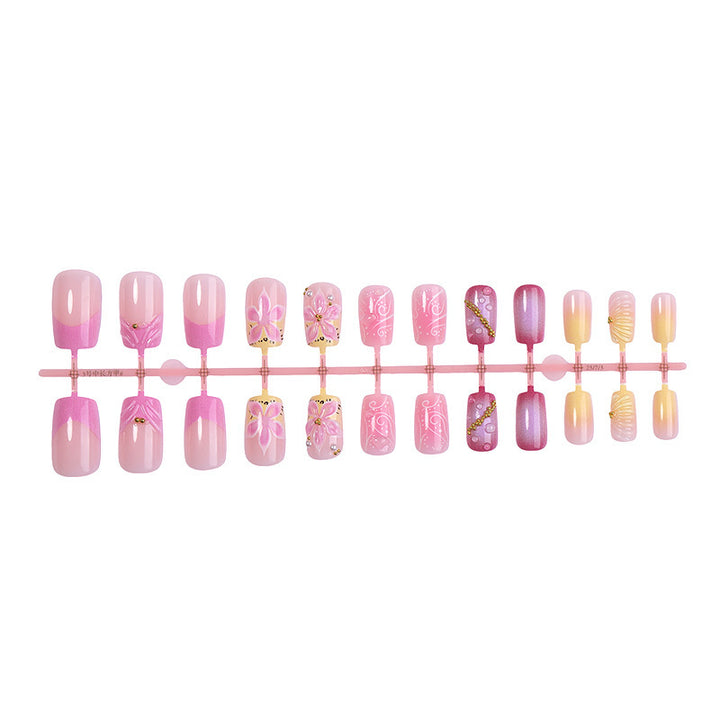 Künstliche Nagelkollektion mit floralem Design und Glitzerakzenten Karnz