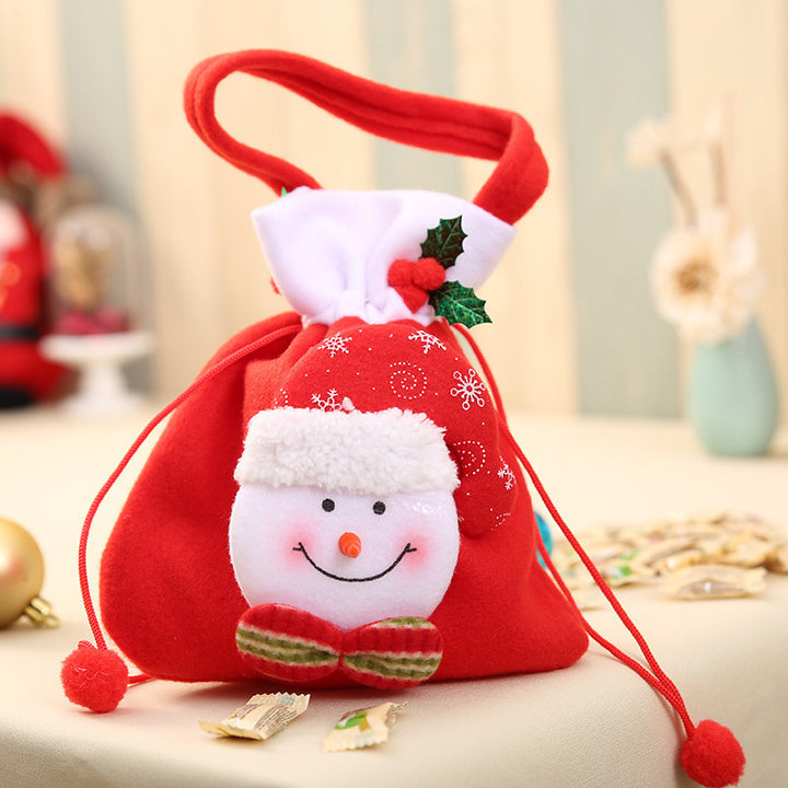 Niedlicher Weihnachtsgnom mit Geschenkesack Karnz