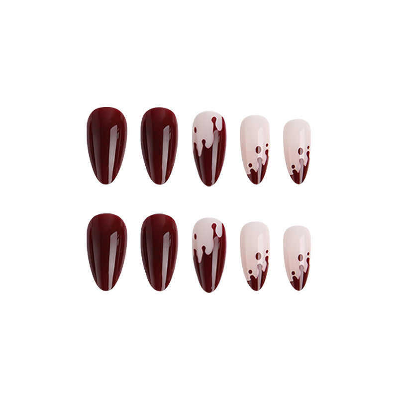 Kunstvolle Nagelspitzen mit Tropfen-Design Karnz