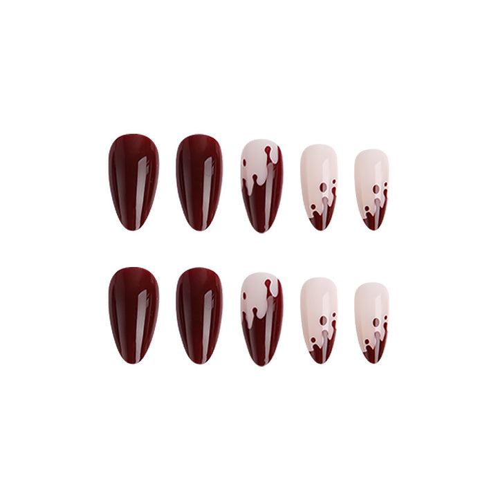 Kunstvolle Nagelspitzen mit Tropfen-Design Karnz