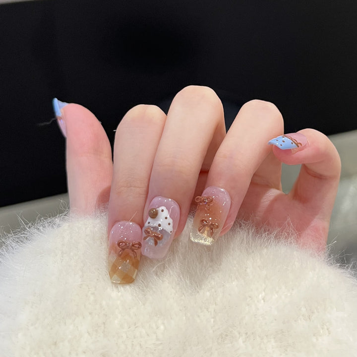 Dekoratives Press-On Nagelkunst Set mit charmanten Schleifenakzenten Karnz