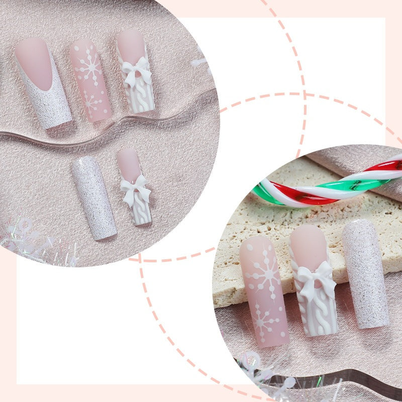 Kunstnagelset mit eleganten Blüten- und Glitzerverzierungen Karnz