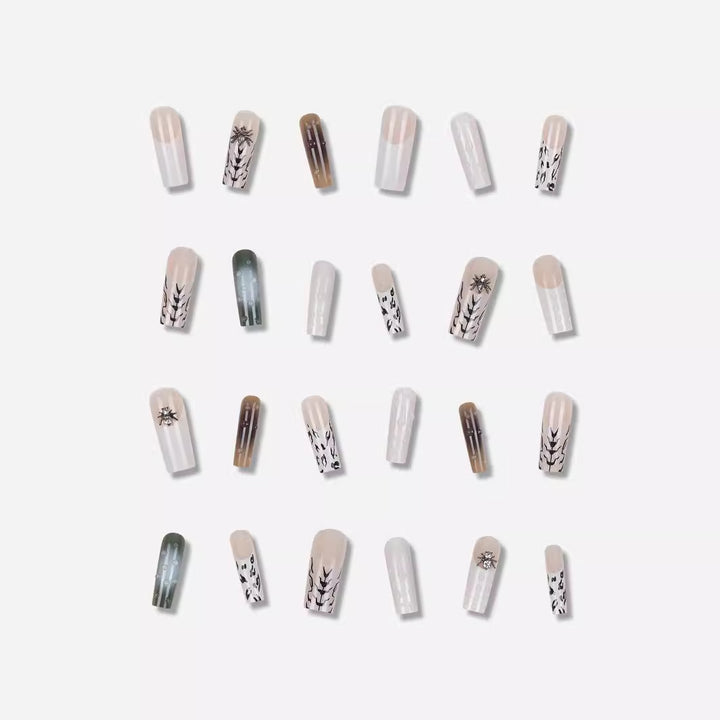 Künstlerisches Langes Stiletto Press-On Nagelset mit einzigartigen Mustern Karnz