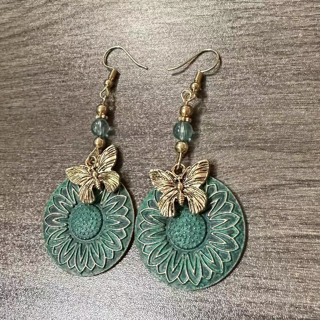 Elegante Ohrhänger mit Blumenmotiv und Schmetterlingen Karnz