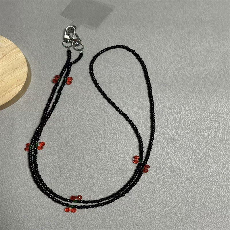 Perlen-Brillenband mit künstlerischen Charms Karnz