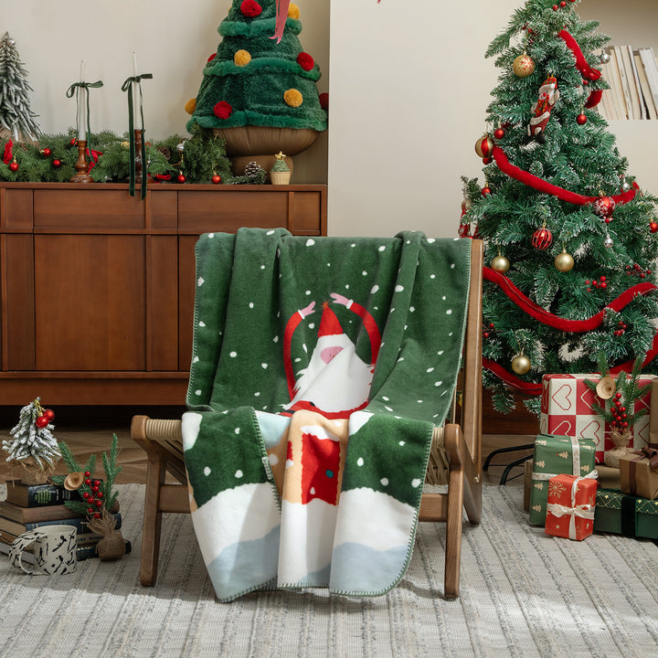 Weiche Weihnachts-Fleecedecke mit Geschenk- und Lebkuchenmotiv Karnz