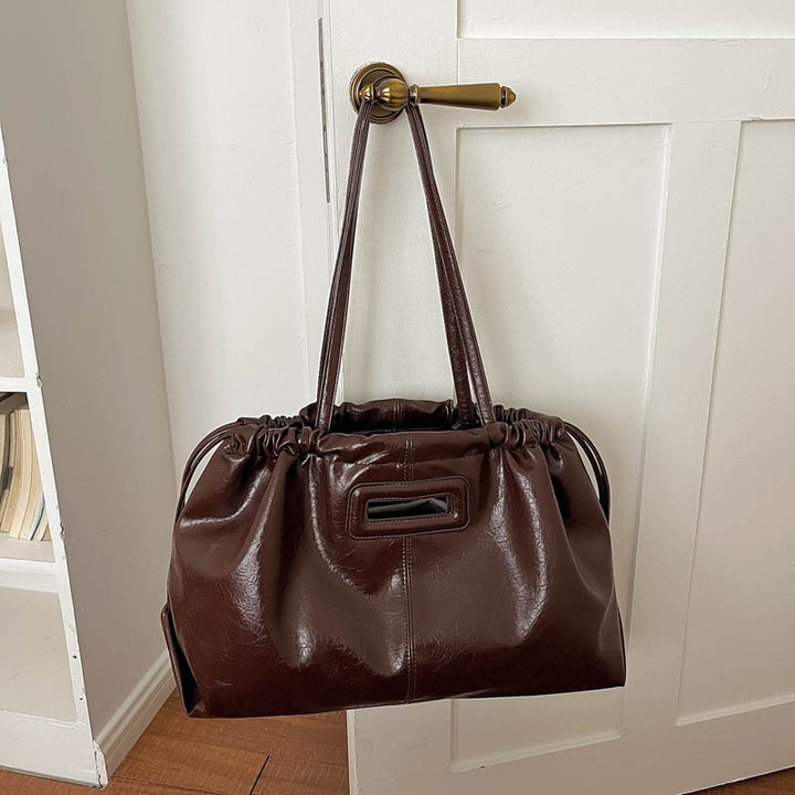 Elegante geraffte Lederhandtasche