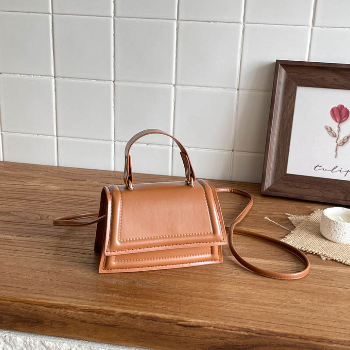 Strukturierte Mini-Crossbody-Handtasche
